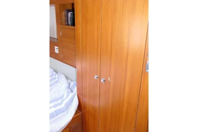 Slide: The Image of Wooden interior of 2014 Tayana Isara 50 yacht cabin with bed and storage. - 53