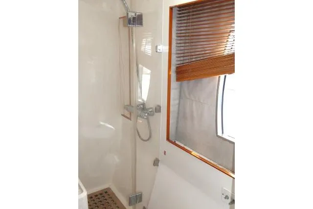 Slide: The Image of Shower area in 2014 Tayana Isara 50 yacht with wooden blinds and modern fixtures. - 55