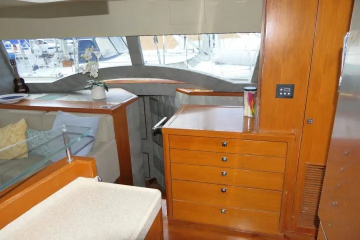 Slide: The Image of Interior of 2014 Tayana Isara 50 yacht with wooden cabinetry and seating area. - 6