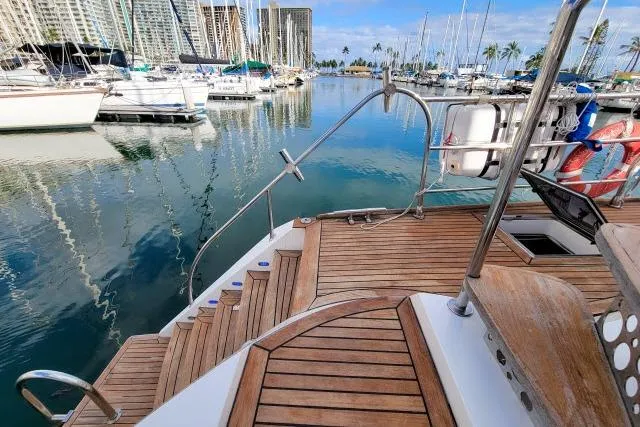 Slide: The Image of Luxurious 2014 Tayana Isara 50 yacht docked in a serene marina setting. - 60
