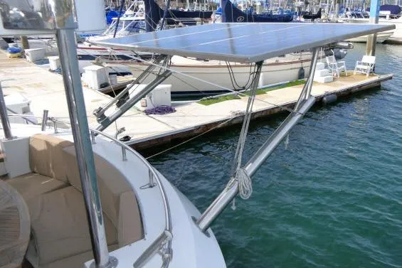 Slide: The Image of Sailboat Tayana Isara 50 (2014) with solar panels docked at marina. - 62