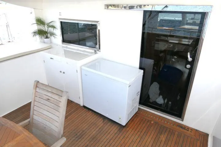 Slide: The Image of Outdoor deck of 2014 Tayana Isara 50 yacht with wooden flooring and appliances. - 67