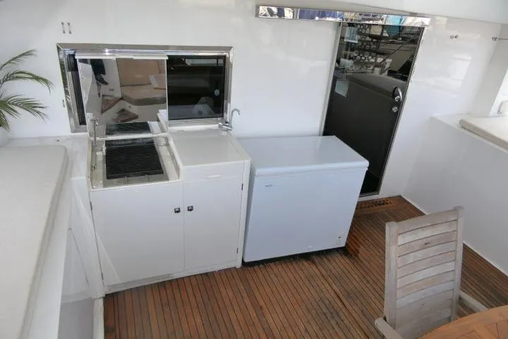 Slide: The Image of Outdoor kitchen area on 2014 Tayana Isara 50 yacht with grill and freezer. - 68