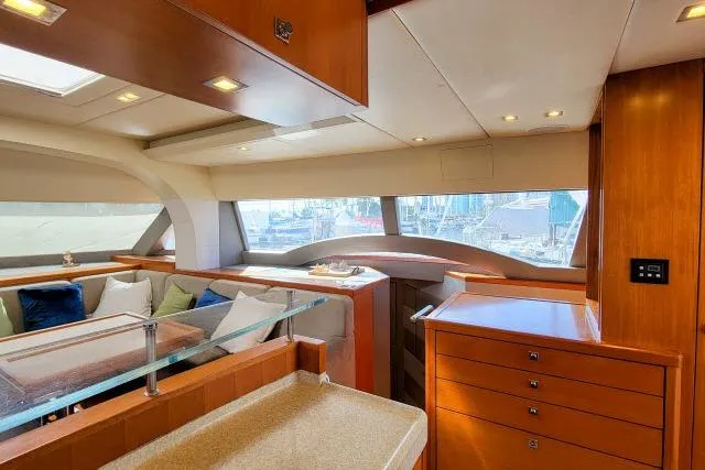 Slide: The Image of Luxurious interior of 2014 Tayana Isara 50 yacht with elegant wood finish and ample seating. - 7