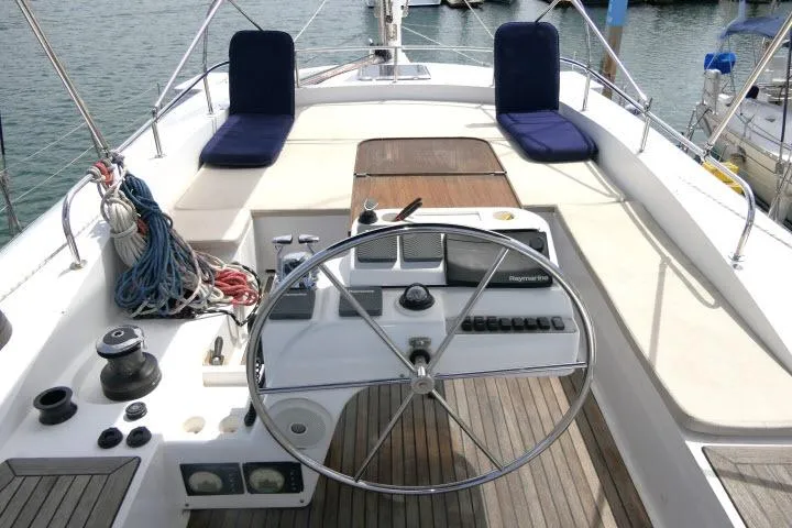 Slide: The Image of Cockpit of 2014 Tayana Isara 50 yacht with steering wheel and seating. - 76