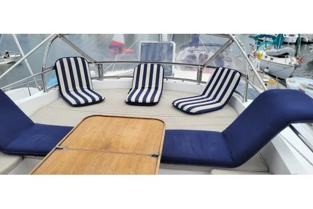 Slide: The Image of Luxurious seating area on 2014 Tayana Isara 50 yacht with striped cushions. - 78