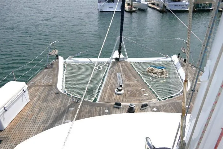 Slide: The Image of Deck view of 2014 Tayana Isara 50 yacht with netting and ropes in marina. - 84