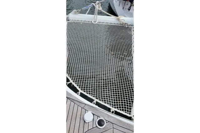 Slide: The Image of Trampoline netting on 2014 Tayana Isara 50 catamaran, docked with visible deck details. - 86