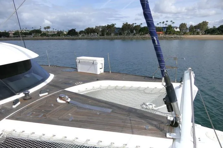 Slide: The Image of Tayana Isara 50 yacht deck, 2014 model, with scenic waterfront view. - 88