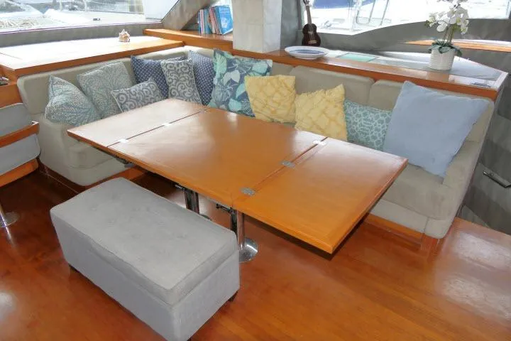 Slide: The Image of Interior of 2014 Tayana Isara 50 yacht with cozy seating and wooden table. - 9