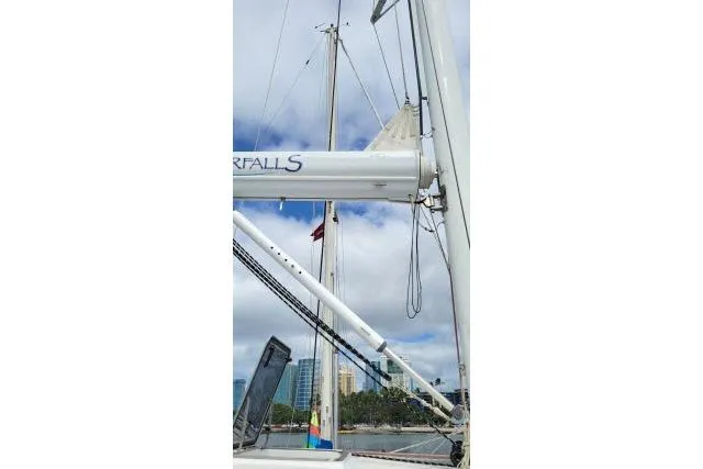 Slide: The Image of Sailboat mast and rigging of 2014 Tayana Isara 50, with city skyline in background. - 92