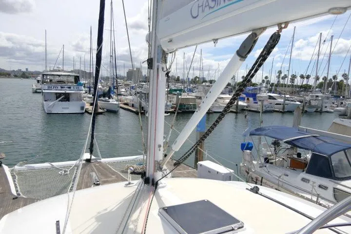 Slide: The Image of 2014 Tayana Isara 50 sailboat docked in a marina with other boats. - 93
