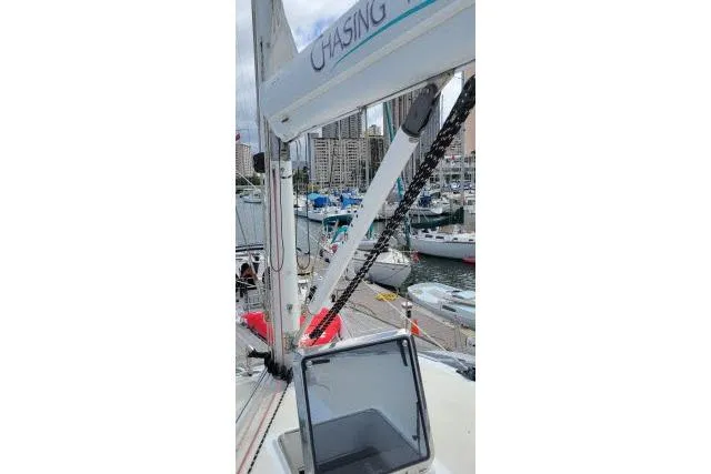 Slide: The Image of 2014 Tayana Isara 50 sailboat docked in a marina with city skyline. - 94