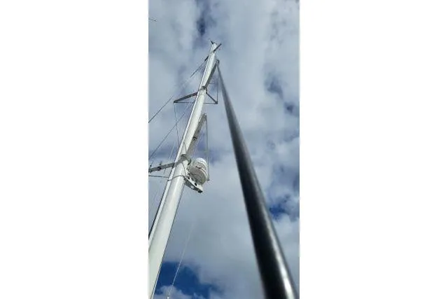 Slide: The Image of Tall mast of 2014 Tayana Isara 50 sailboat against cloudy sky. - 96