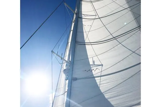 Slide: The Image of Sail of 2014 Tayana Isara 50 yacht against a bright blue sky. - 97
