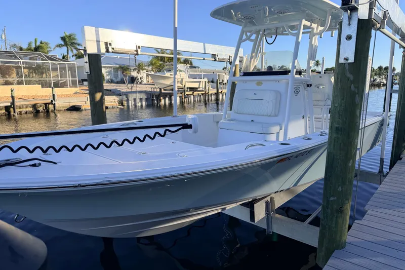 The Image of 2020 Sportsman Masters 247 Bay Boat docked at marina, sunny day, waterfront view. - 0