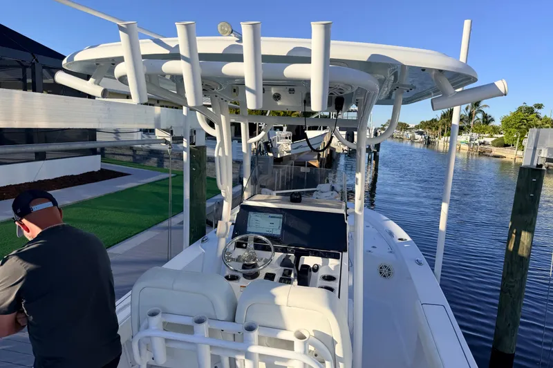 Slide: The Image of 2020 Sportsman Masters 247 Bay Boat docked, featuring a sleek design and modern controls. - 3
