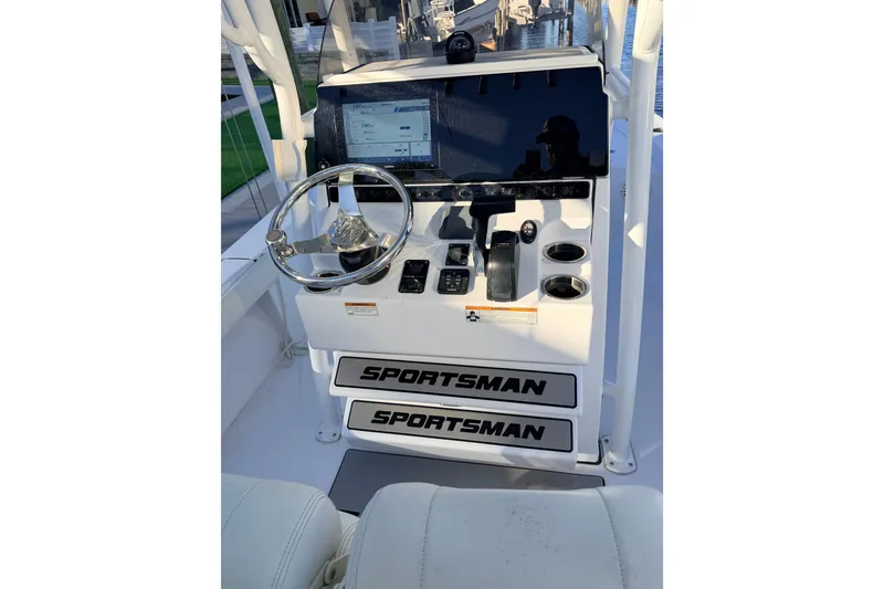 Slide: The Image of 2020 Sportsman Masters 247 Bay Boat console with steering wheel and controls. - 4