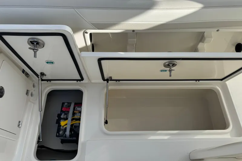 Slide: The Image of Storage compartments on a 2026 World Cat 235 TE boat, showcasing organized interior space. - 13
