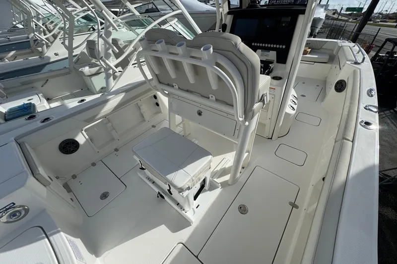Slide: The Image of 2026 World Cat 235 TE boat interior with seating and control panel, showcasing modern design. - 9