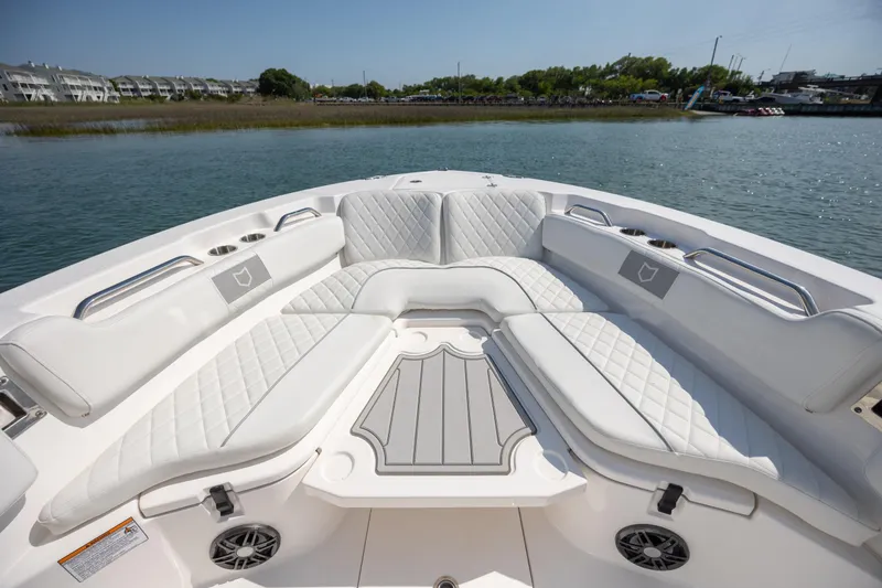 Slide: The Image of 2025 Sea Fox 228 Commander boat interior with luxurious white seating and scenic water view. - 11