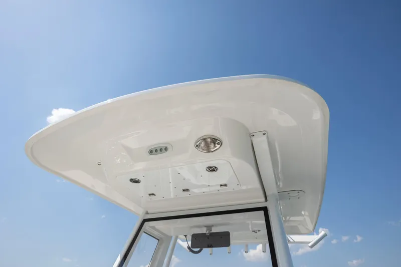 Slide: The Image of T-top of 2025 Sea Fox 228 Commander boat against clear blue sky. - 13
