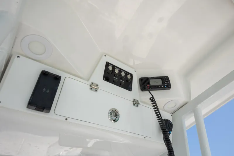 Slide: The Image of 2025 Sea Fox 228 Commander boat console with radio and control panel. - 15