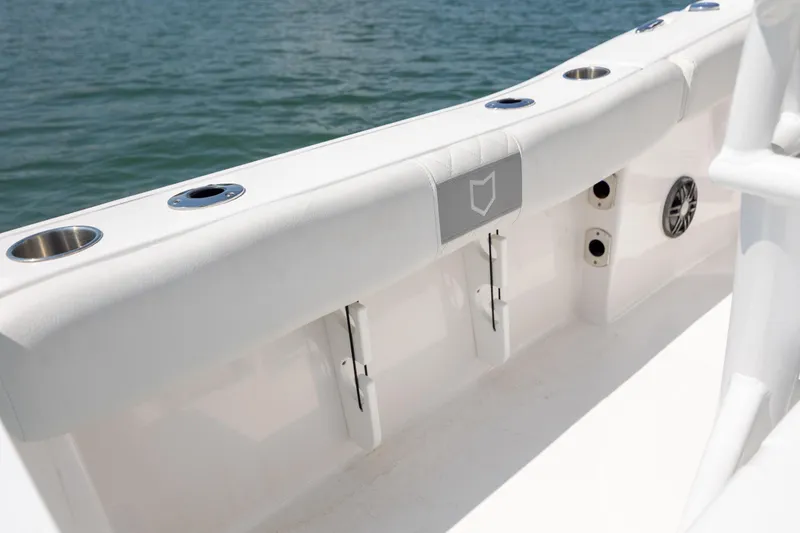 Slide: The Image of Interior view of 2025 Sea Fox 228 Commander boat, featuring rod holders and cup holders. - 20