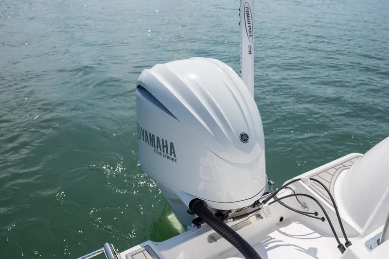 Slide: The Image of Yamaha four-stroke engine on 2025 Sea Fox 228 Commander boat in water. - 23
