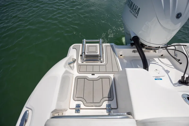 Slide: The Image of 2025 Sea Fox 228 Commander boat with Yamaha engine and swim platform ladder. - 24