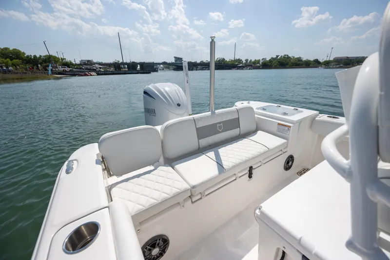 Slide: The Image of 2025 Sea Fox 228 Commander boat interior with Yamaha engine, docked on a sunny day. - 25