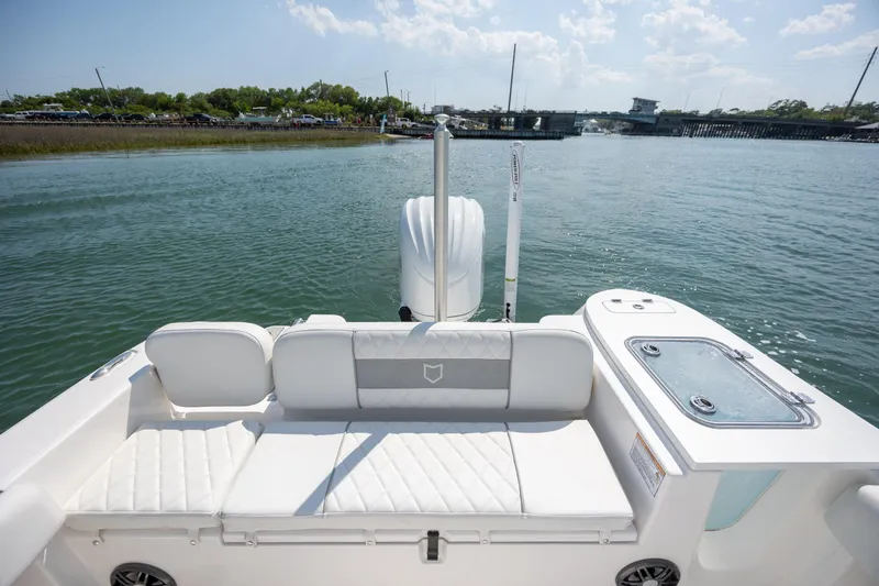 Slide: The Image of 2025 Sea Fox 228 Commander boat interior with seating and water view. - 26