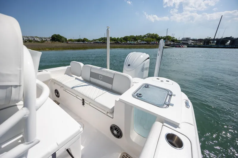 Slide: The Image of 2025 Sea Fox 228 Commander boat interior with seating and water view. - 27
