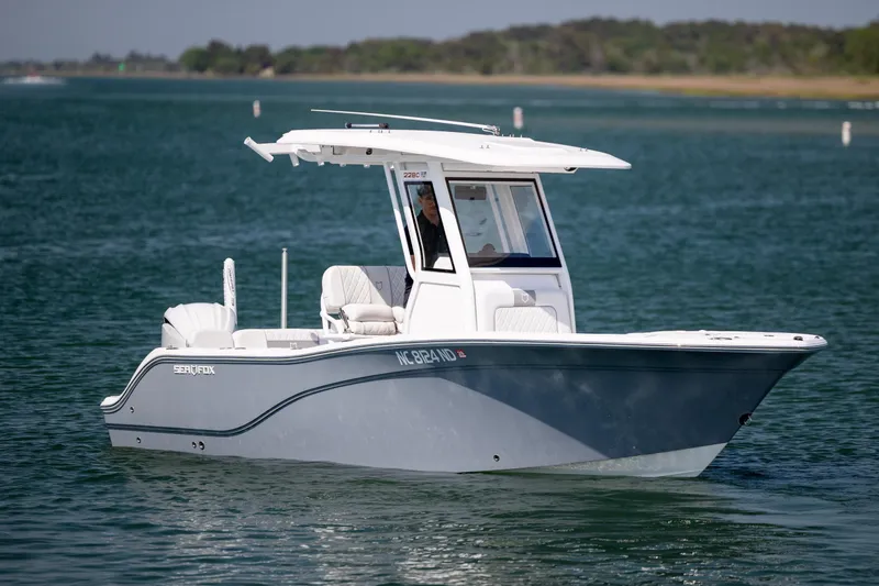 Slide: The Image of 2025 Sea Fox 228 Commander boat cruising on a serene lake. - 4