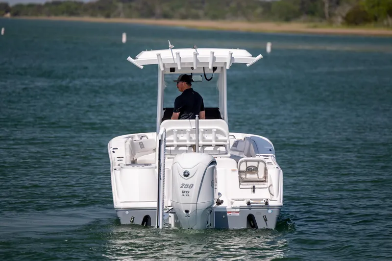 Slide: The Image of 2025 Sea Fox 228 Commander boat cruising on a serene lake. - 7