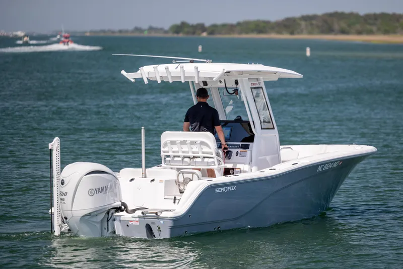 Slide: The Image of 2025 Sea Fox 228 Commander boat cruising on a calm waterway. - 8