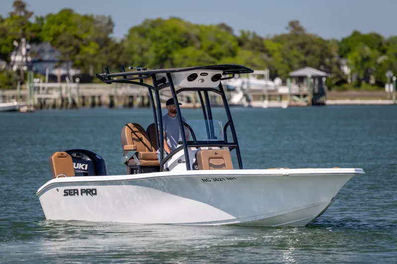 The Image of 2025 Sea Pro 202 Center Console boat cruising on a calm lake. - 1