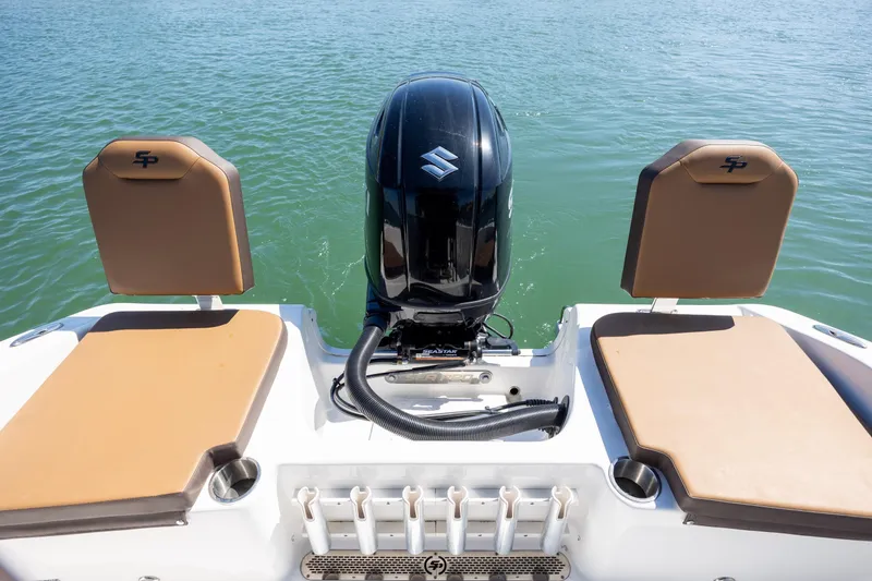 Slide: The Image of 2025 Sea Pro 202 Center Console boat with Suzuki outboard motor on calm water. - 13