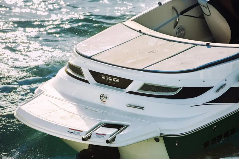 Slide: The Image of Manufacturer Provided Image: 2014 Sea Ray 190 Sport boat on water, rear view. - 10