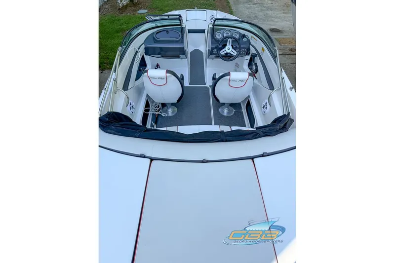 Slide: The Image of 2014 Sea Ray 190 Sport boat interior with steering wheel and seating. - 14