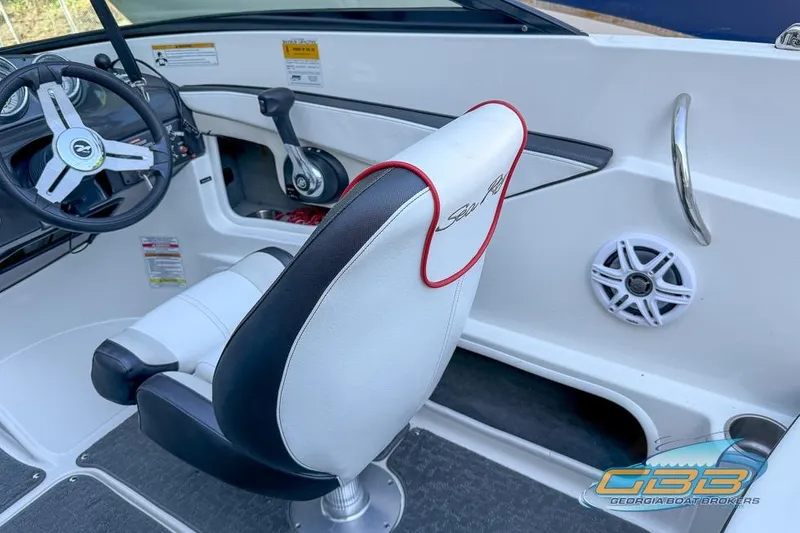 Slide: The Image of Interior of a 2014 Sea Ray 190 Sport boat, featuring steering wheel and seating. - 17