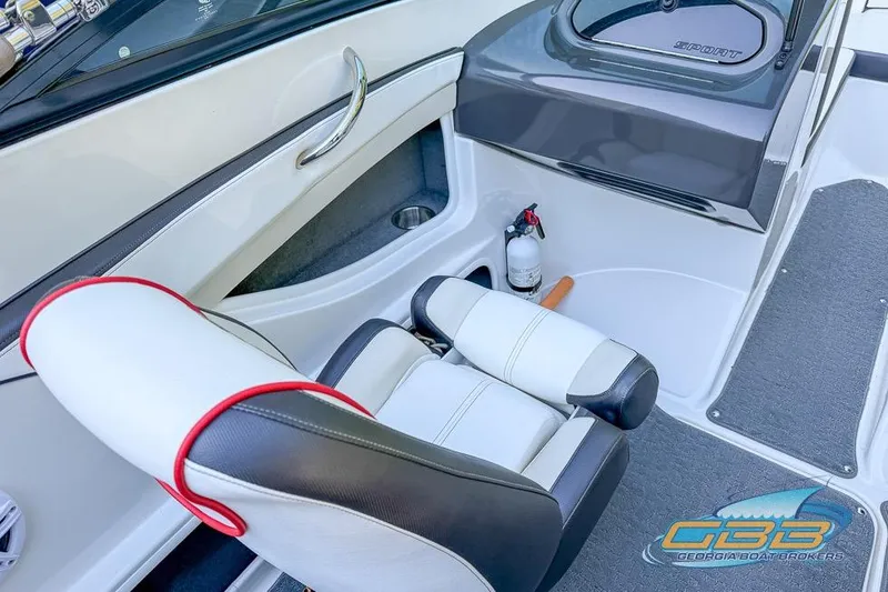 Slide: The Image of Interior of a 2014 Sea Ray 190 Sport boat, featuring seating and safety equipment. - 19