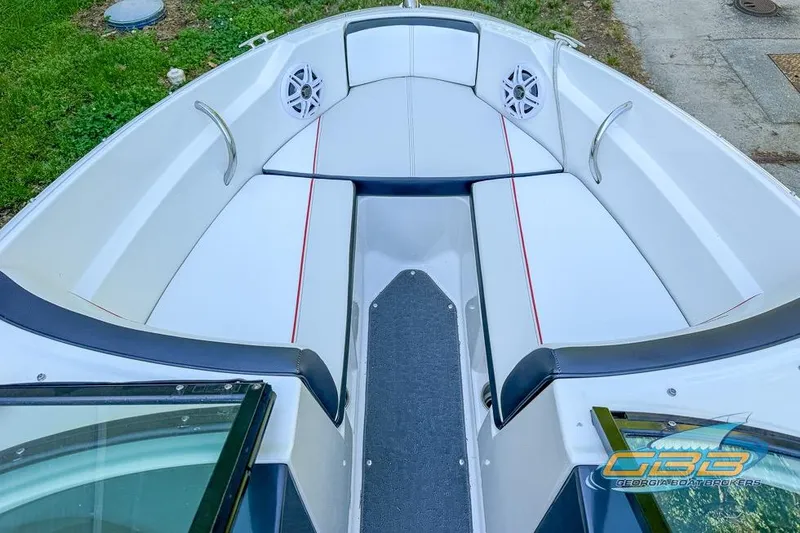 Slide: The Image of 2014 Sea Ray 190 Sport boat interior with white seating and red accents. - 3