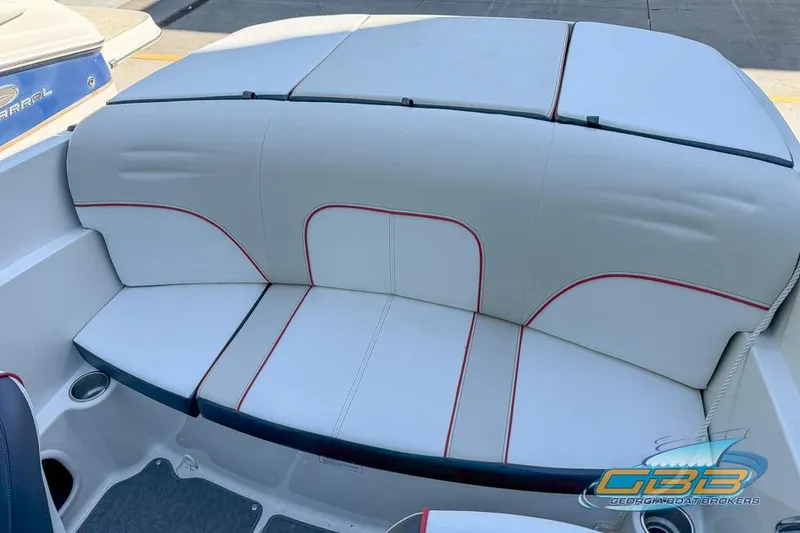 Slide: The Image of 2014 Sea Ray 190 Sport boat interior with white and red-trimmed seating. - 6