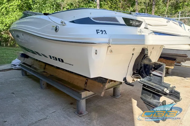 Slide: The Image of 2014 Sea Ray 190 Sport boat on display, featuring sleek design and powerful engine. - 9