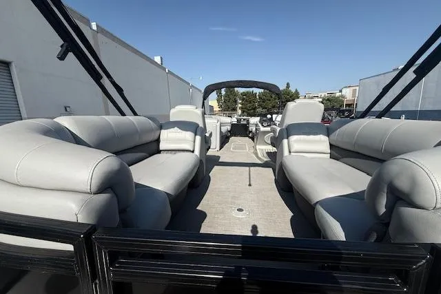 Slide: The Image of 2018 Regency 254 LE3 pontoon boat with spacious seating and modern design. - 18