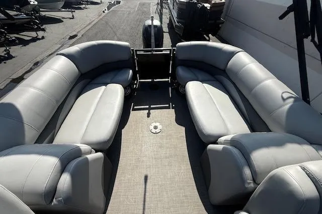Slide: The Image of 2018 Regency 254 LE3 pontoon boat with spacious gray seating and modern design. - 21