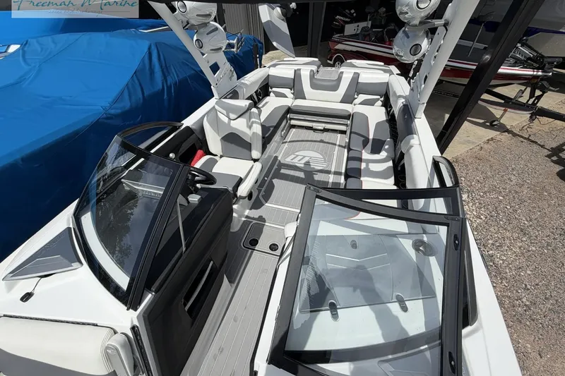 Slide: The Image of 2019 Malibu Wakesetter 24 MXZ boat interior with spacious seating and modern design. - 13