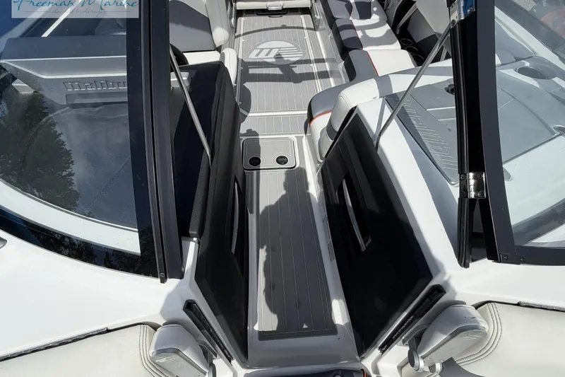 Slide: The Image of 2019 Malibu Wakesetter 24 MXZ interior with sleek seating and modern design. - 15