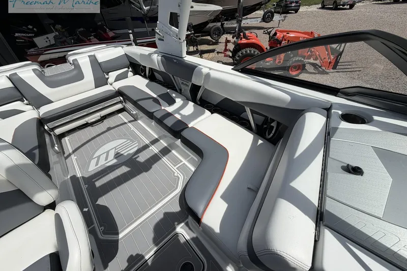 Slide: The Image of 2019 Malibu Wakesetter 24 MXZ interior with sleek seating and modern design. - 16